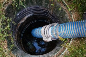 Cleaning sludge from septic system