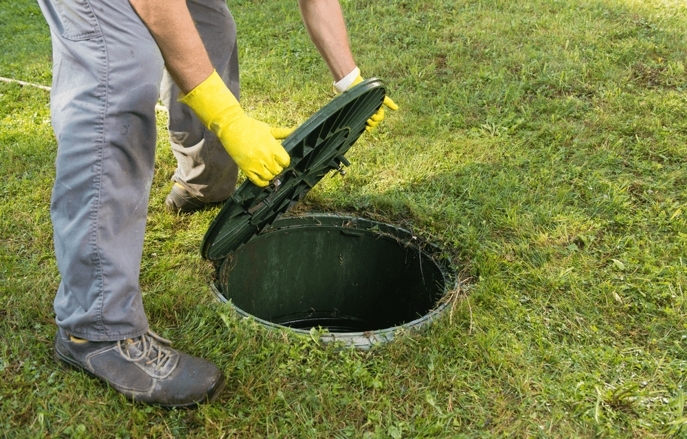 Man opening Daytona Septic Tank Plumbing